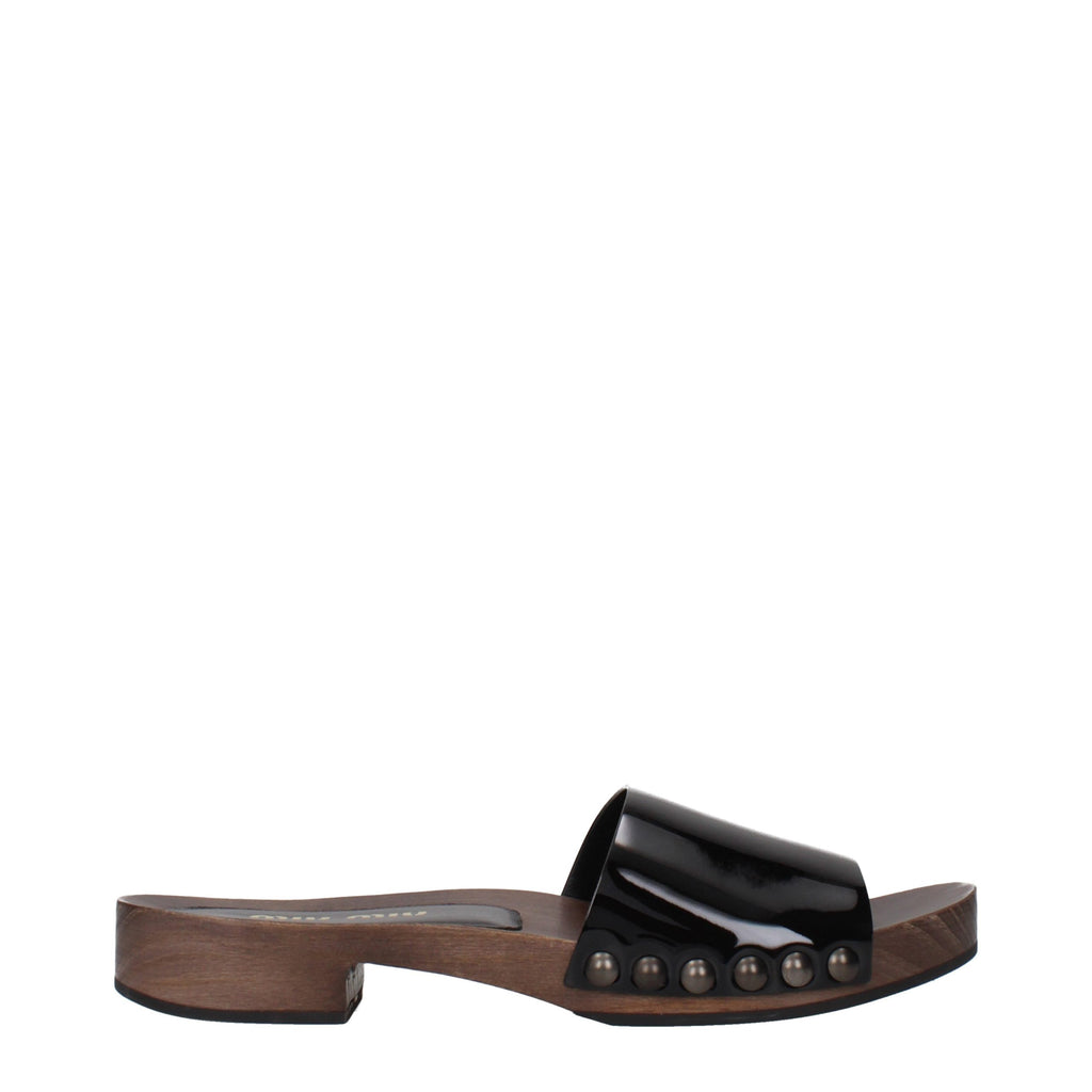 Mules Miu Miu en cuir noir